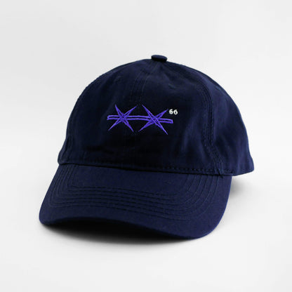 Angle view of the embroidered Barbed Wire navy blue dad hat from PHOSIS Clothing