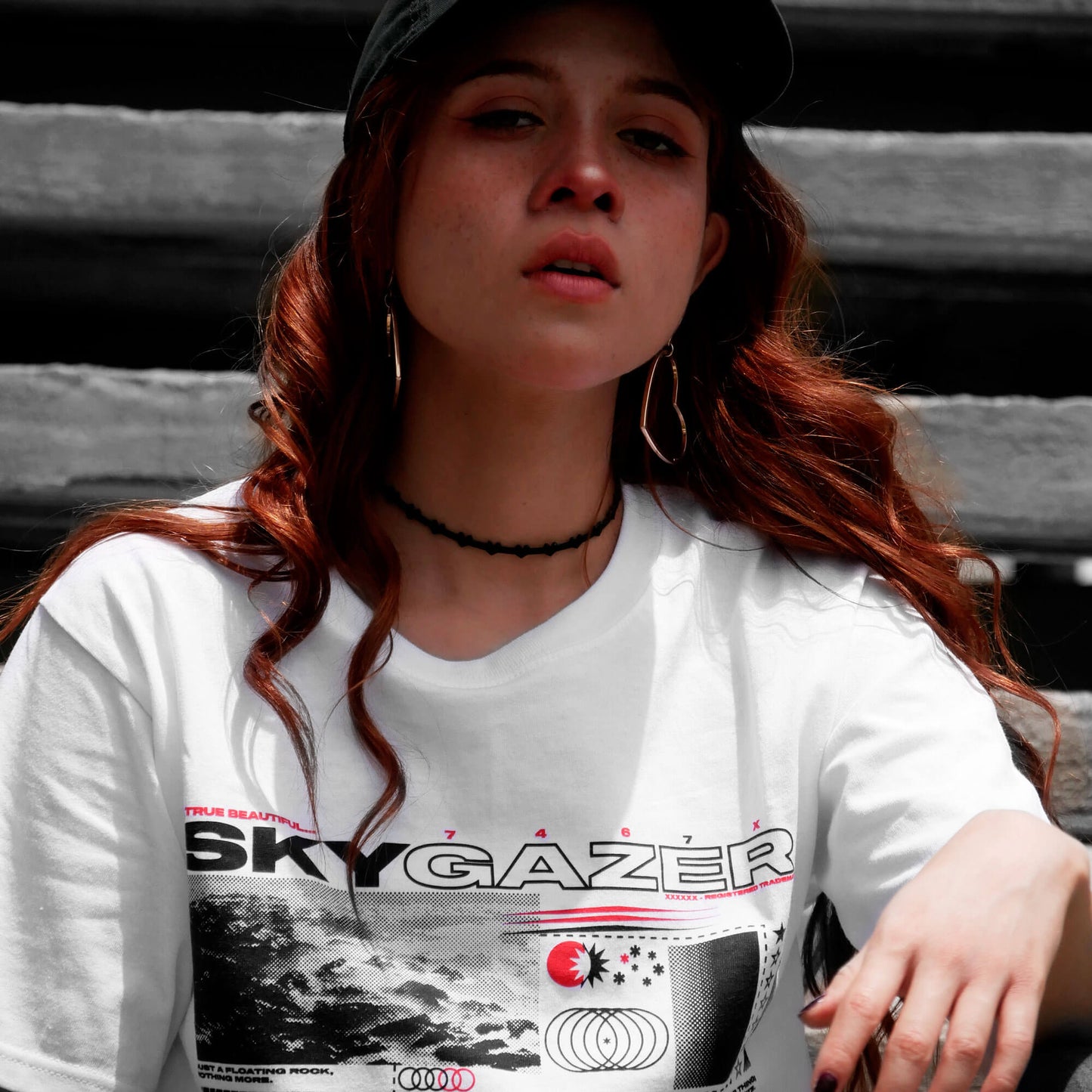 Close up view of model wearing SKYGAZER white t-shirt from PHOSIS Clothing