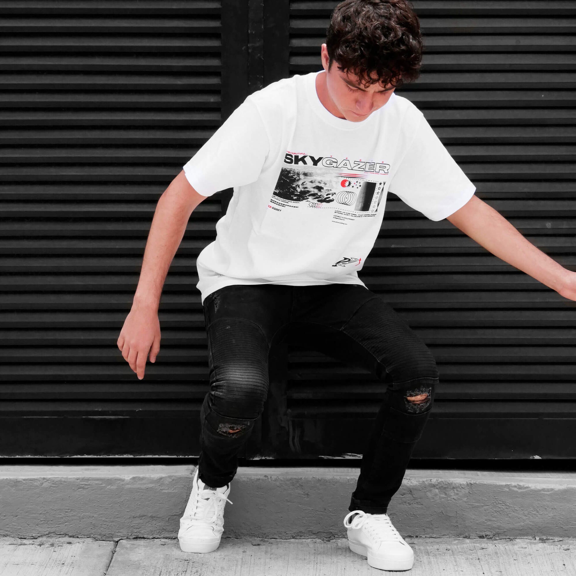Front view of model wearing SKYGAZER white t-shirt from PHOSIS Clothing