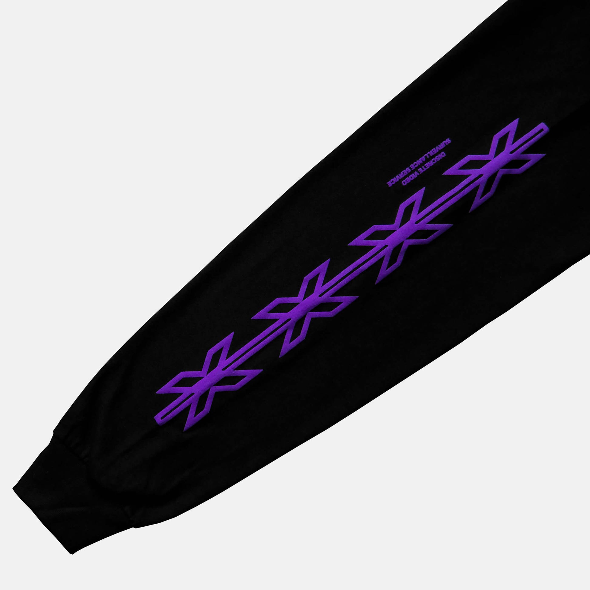 Sleeve close up of the screen-pinted POLYMER black long sleeve from PHOSIS Clothing