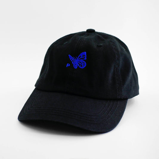 Angle view of the embroidered Buttterfly Logo black dad hat from PHOSIS Clothing